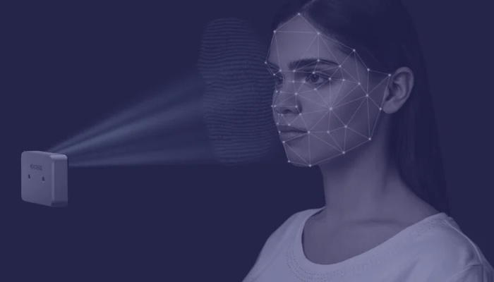 Small camera scanning woman&#039;s face for facial authentication. 